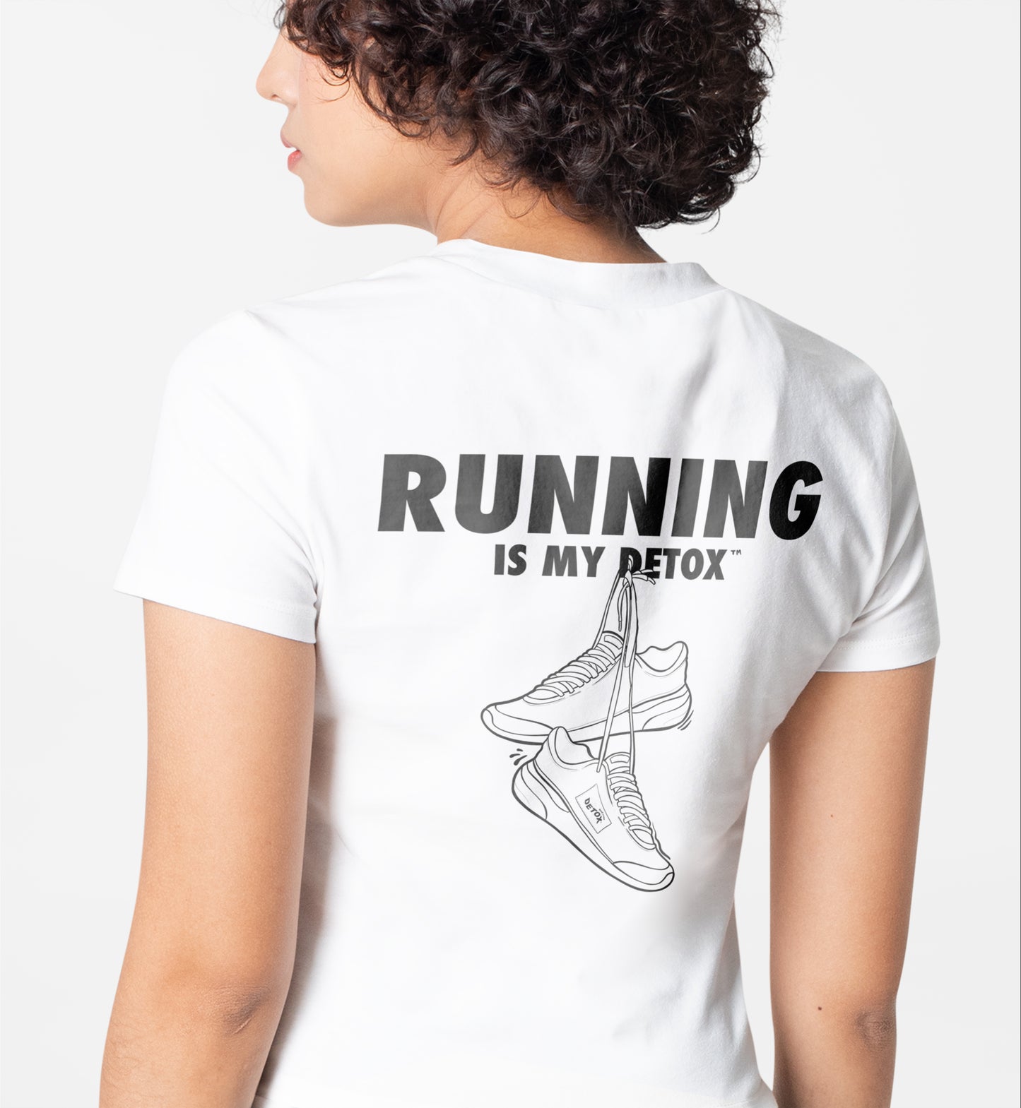 woman wearing tshirt.  Running Is My Detox and sneaker design.